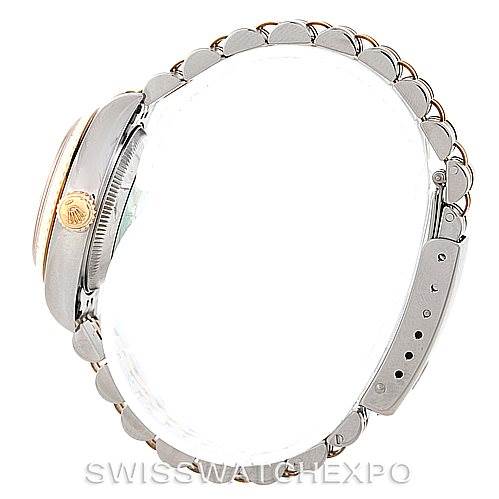 This image shows a Rolex Datejust 69173 Women's Stainless Steel Beige Dial 69173 Women's Stainless Steel Beige Dial watch from a side view, displaying the bracelet, crown, and case.