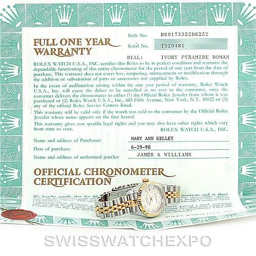 The image shows a Rolex Datejust 69173 Women's Stainless Steel Beige Dial 69173 Women's Stainless Steel Beige Dial watch and its warranty certificate from a top-down angle.