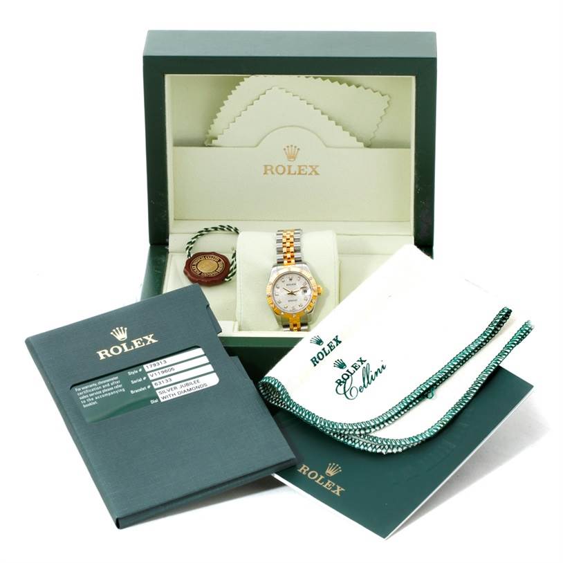 The Rolex Datejust 179313 Women's Stainless Steel Beige Dial 179313 Women's Stainless Steel Beige Dial watch is shown in its box with accessories, including the certificate, booklet, and tags.