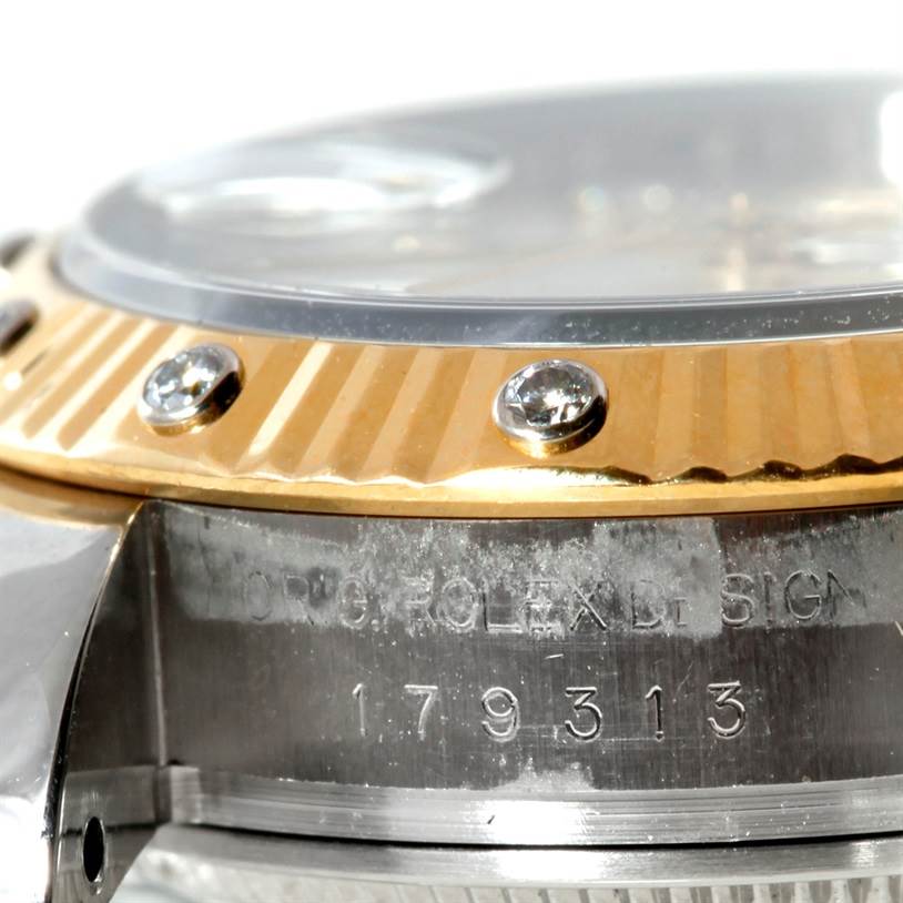 This image shows a close-up of the bezel and part of the case, featuring the model number and engravings of the Rolex Datejust 179313 Women's Stainless Steel Beige Dial 179313 Women's Stainless Steel Beige Dial watch.