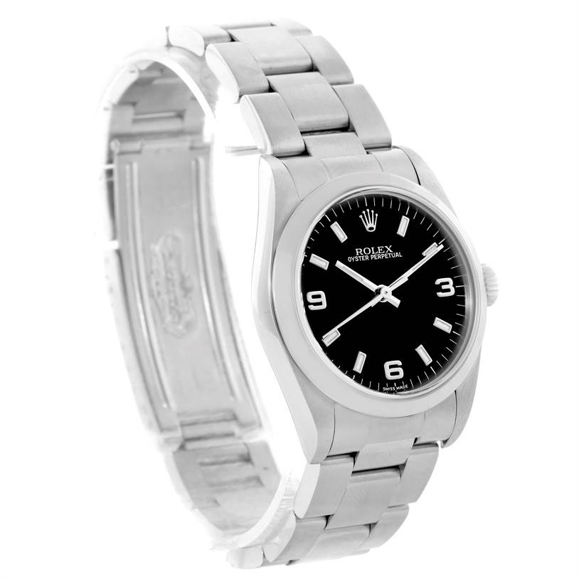 The image shows a Rolex Oyster Perpetual Mid-Size watch angled to display the black dial and silver bracelet clearly.