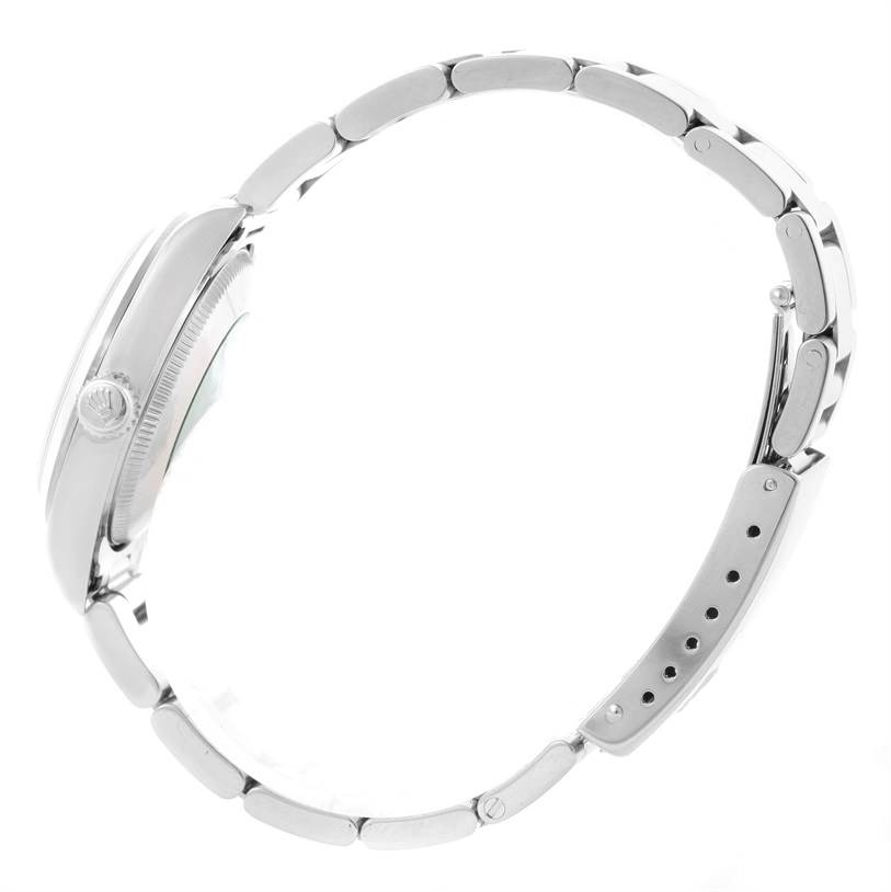 This side-angle view of the Rolex Mid-Size 77080 Men's Stainless Steel Black Dial 77080 Men's Stainless Steel Black Dial model showcases the watch's bracelet, clasp, and crown.