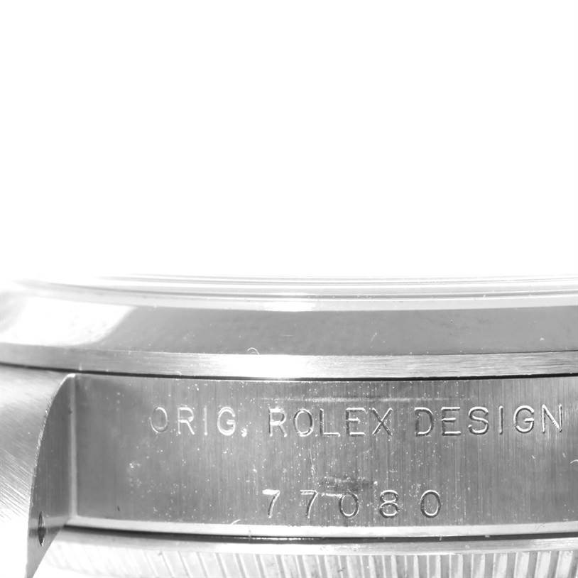 The image shows a close-up, side angle of a Mid-Size Rolex watch, focusing on the engraved case with "ORIG. ROLEX DESIGN 77080."