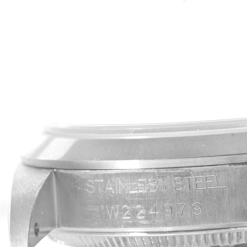 This image shows a close-up of the side case and bezel engraving on a Rolex Mid-Size 68240 Women's Stainless Steel Blue Dial 68240 Women's Stainless Steel Blue Dial model watch.