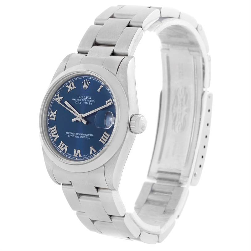 The Rolex Mid-Size 68240 Women's Stainless Steel Blue Dial 68240 Women's Stainless Steel Blue Dial watch is shown at a three-quarter angle, highlighting its blue dial, bracelet, crown, and partially open clasp.