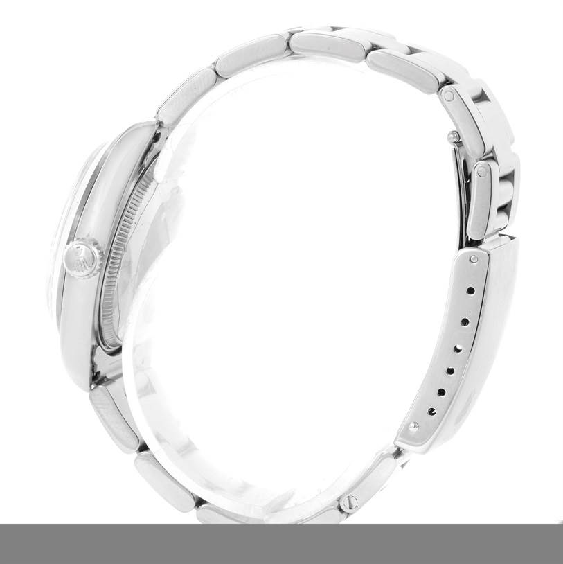 The image shows a side profile of a Rolex Mid-Size 68240 Women's Stainless Steel Blue Dial 68240 Women's Stainless Steel Blue Dial watch, highlighting the crown, case, and bracelet.