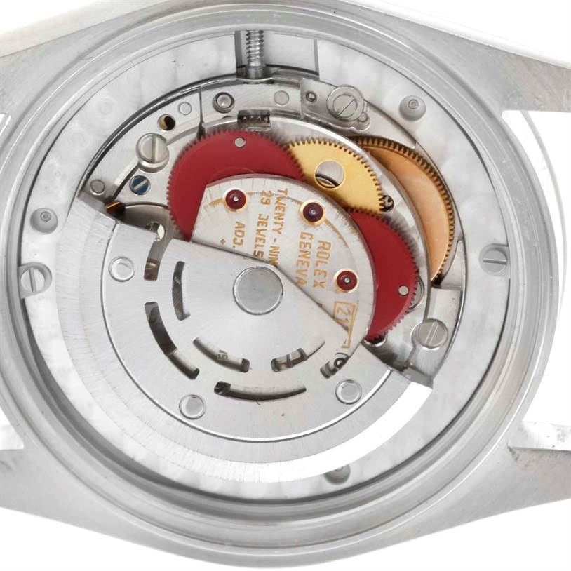This image shows the internal mechanism of a Rolex Mid-Size 68240 Women's Stainless Steel Blue Dial 68240 Women's Stainless Steel Blue Dial watch, highlighting various gears and the movement components.