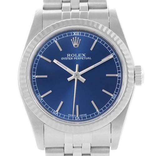 The image shows a front view of a Rolex Mid-Size 77014 Women's Stainless Steel Blue Dial 77014 Women's Stainless Steel Blue Dial Oyster Perpetual watch featuring a blue dial and a silver bracelet.