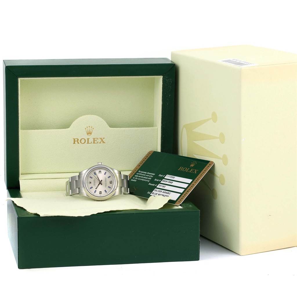 The image shows a Rolex Mid-Size 177200 Women's Stainless Steel Silver Dial 177200 Women's Stainless Steel Silver Dial watch in its open green box with a warranty card and outer box included.