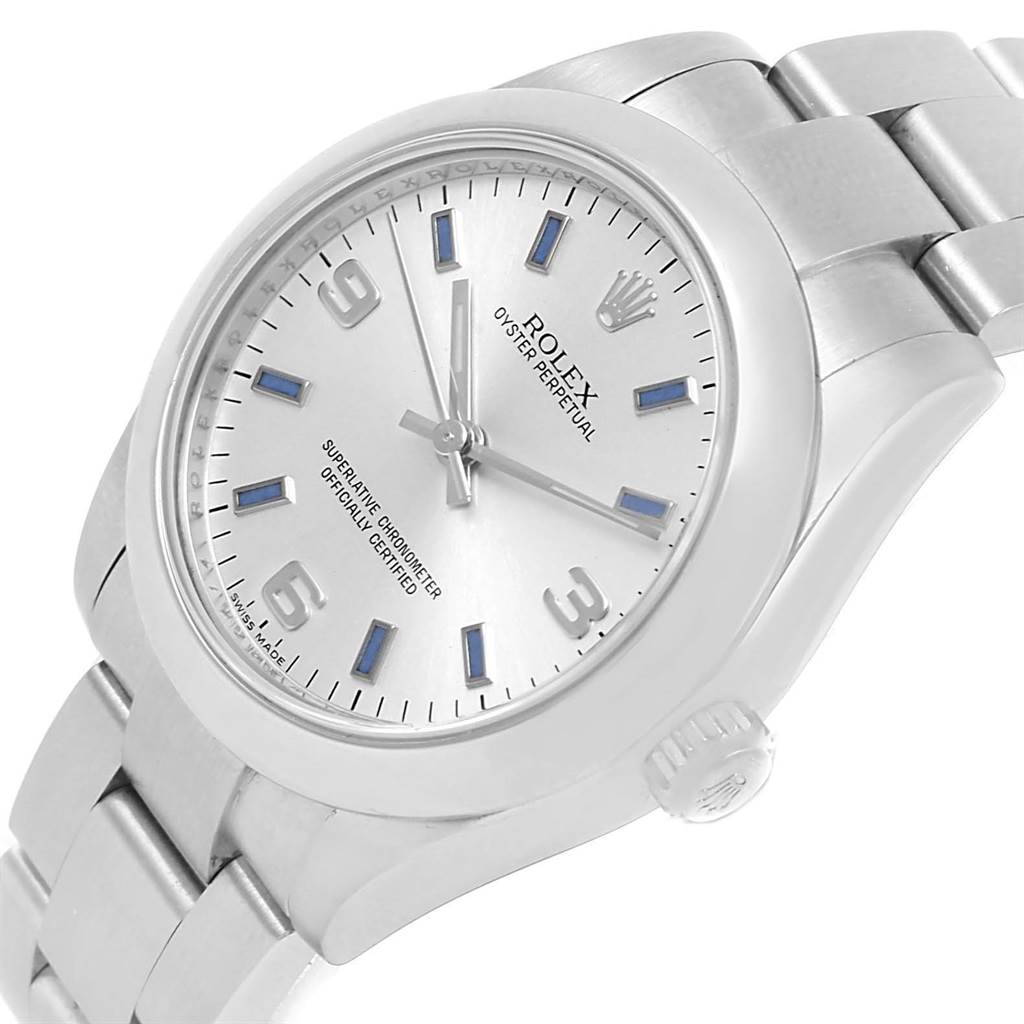 The image shows a Rolex Mid-Size 177200 Women's Stainless Steel Silver Dial 177200 Women's Stainless Steel Silver Dial Oyster Perpetual watch at a three-quarter angle, highlighting its face, bezel, and part of the bracelet.