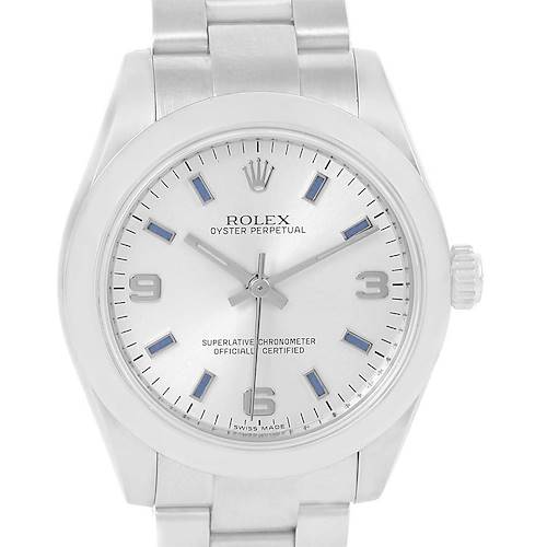 The image shows the front view of a Rolex Oyster Perpetual Mid-Size watch, highlighting its dial, bezel, and bracelet.