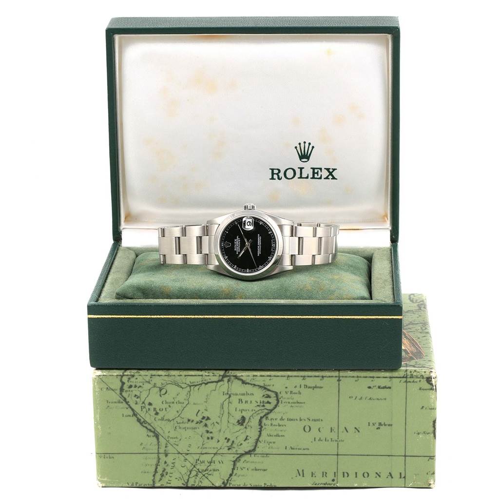 This image shows a frontal view of a Mid-Size Rolex watch inside an open green Rolex-branded box.