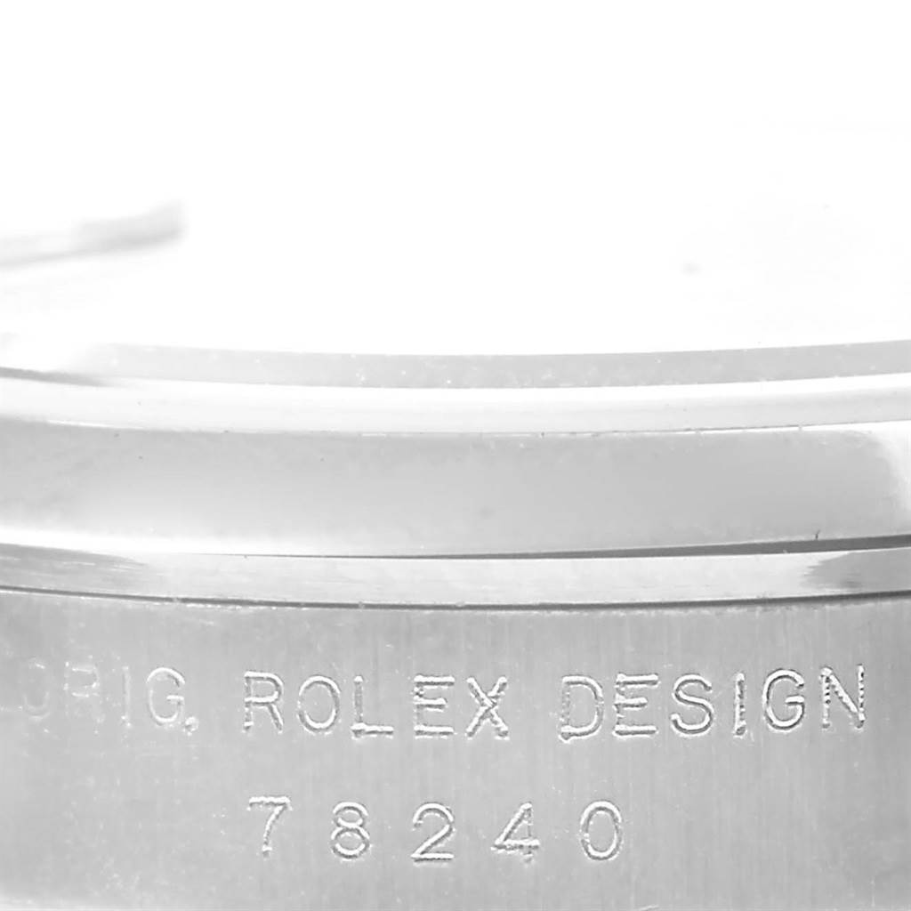 This image shows a close-up of the side of a bezel with the etched text and the model number 78240 of a Mid-Size Rolex watch.