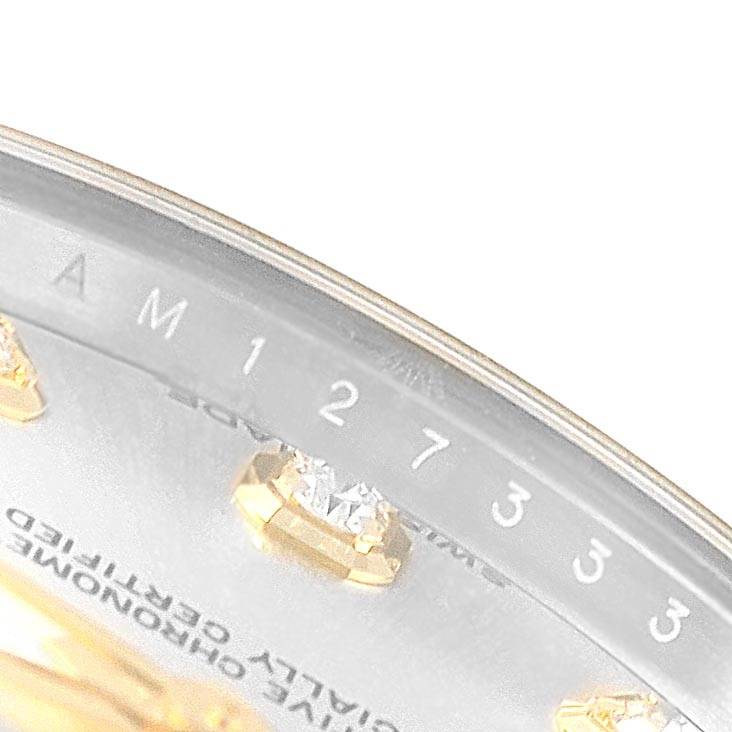 This close-up image shows the dial and diamond markers of a mid-size Rolex watch, with partial view of the text and bezel.