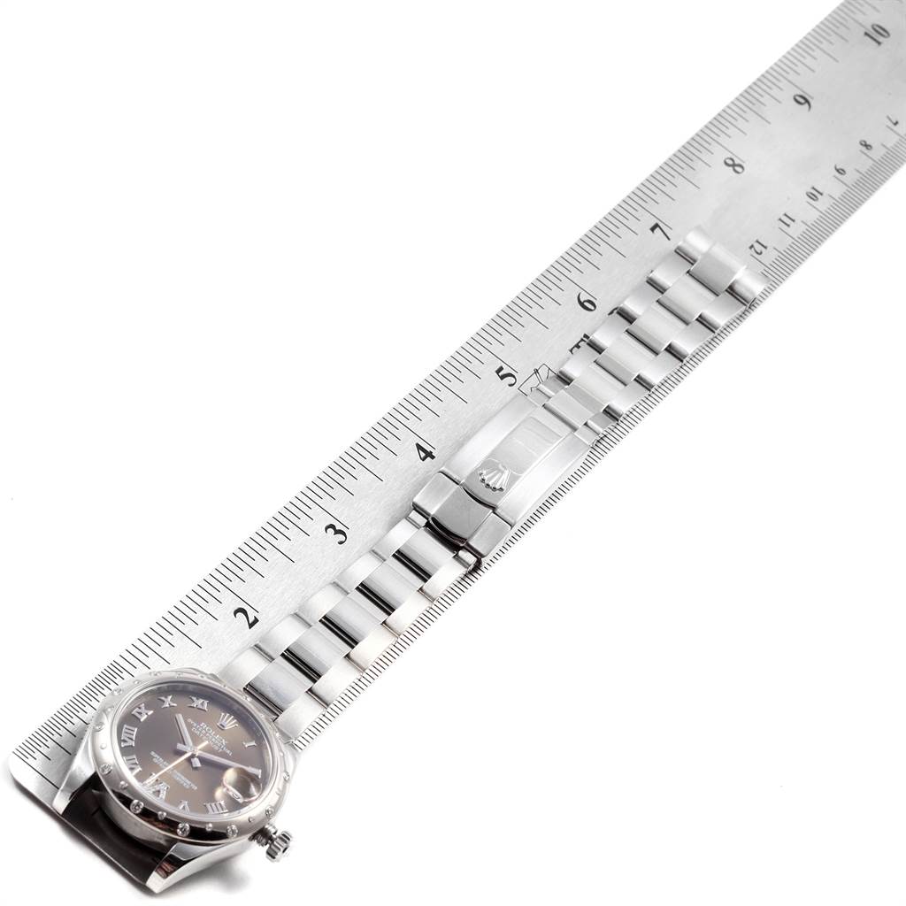 The image shows a flat-lay view of a Rolex Mid-Size 178344 Women's Stainless Steel Brown Dial 178344 Women's Stainless Steel Brown Dial watch, displaying the watch face, bracelet, and clasp placed next to a ruler.