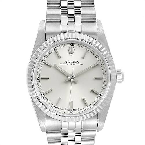 The image shows a front view of a Rolex Oyster Perpetual Mid-Size watch displaying the face, bezel, crown, and part of the bracelet.