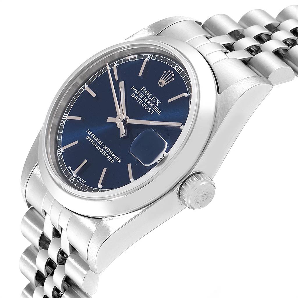 The Rolex Mid-Size 78240 Women's Stainless Steel Blue Dial 78240 Women's Stainless Steel Blue Dial watch is shown from an angled perspective, highlighting its crown, bracelet, and blue dial with date display.