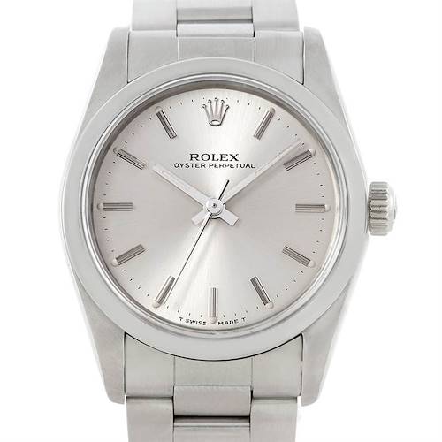 The Rolex Oyster Perpetual Mid-Size watch is shown from the front, featuring the dial, bezel, crown, and part of the bracelet.