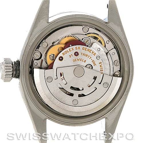 The image shows the back view of the Rolex Date 79160 Women's Stainless Steel White Dial 79160 Women's Stainless Steel White Dial model watch, highlighting its movement mechanism.