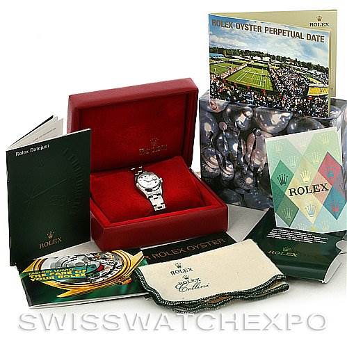 The image shows a Rolex Date 79160 Women's Stainless Steel White Dial 79160 Women's Stainless Steel White Dial model watch in its original box, with booklets, a cleaning cloth, and other packaging accessories.
