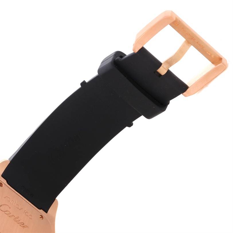 The image shows a close-up of the Santos by Cartier watch strap and buckle.