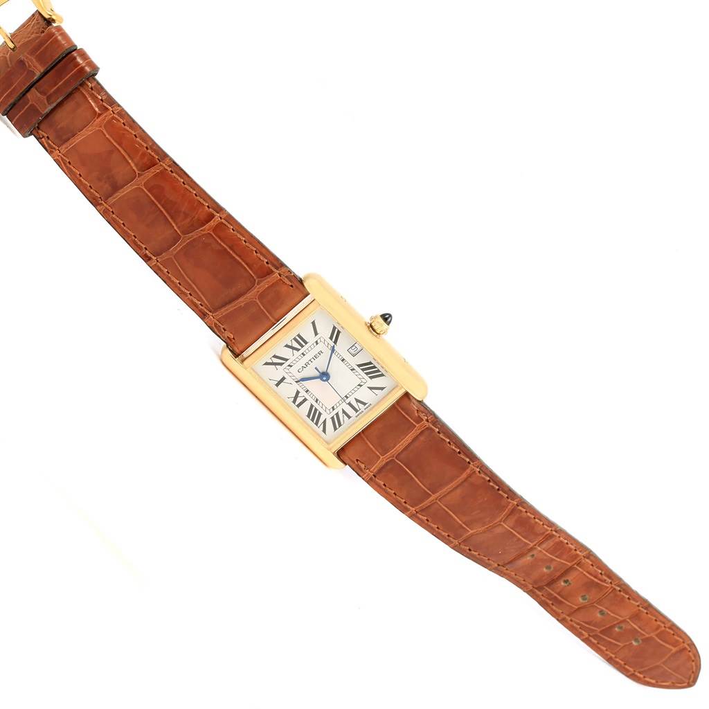 The image shows a top view of a Cartier Tank Louis W1529756 Men's Yellow Gold Silver Dial W1529756 Men's Yellow Gold Silver Dial watch, highlighting its rectangular dial, Roman numerals, and brown leather strap.