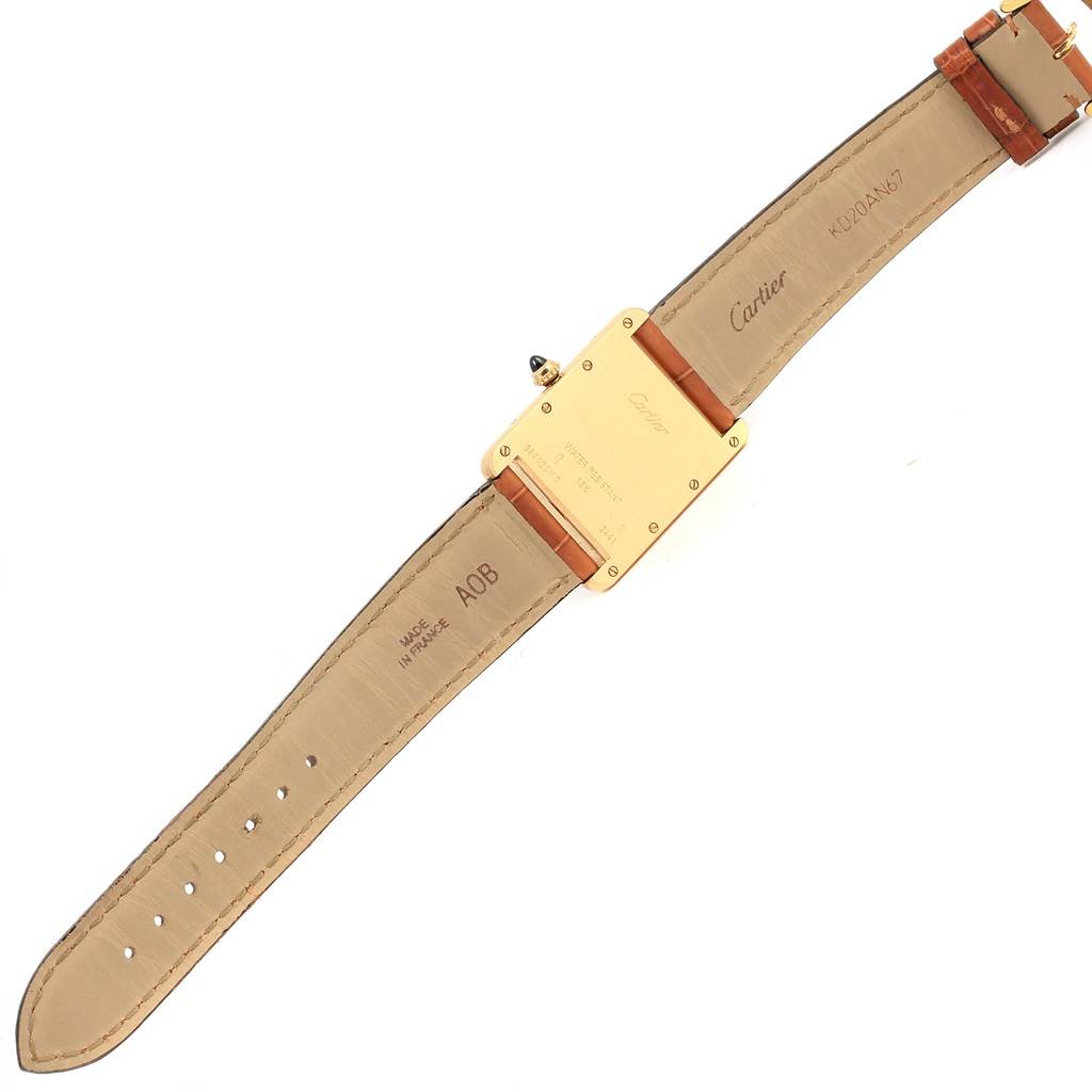 The image shows the back and inside strap of a Cartier Tank Louis W1529756 Men's Yellow Gold Silver Dial W1529756 Men's Yellow Gold Silver Dial watch laid flat, highlighting the brand markings and buckle.