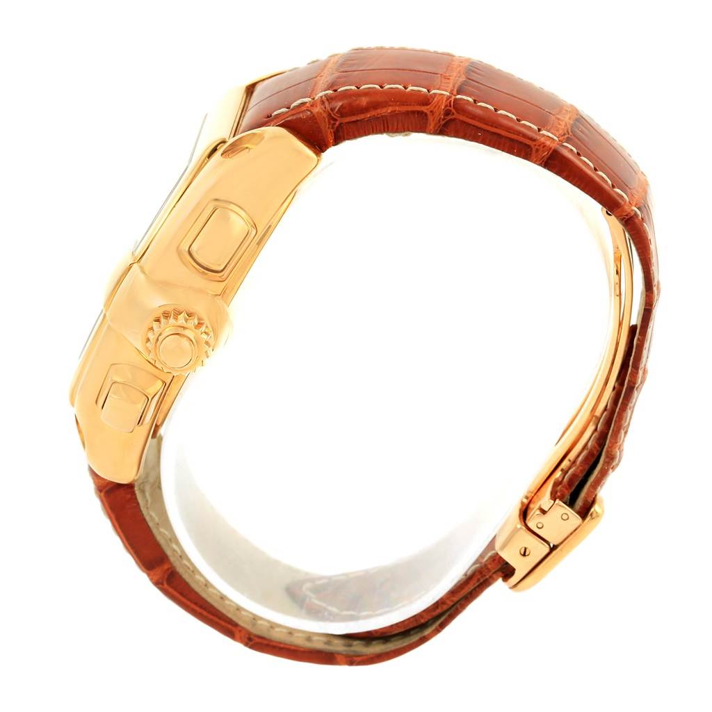 The image shows a Cartier Roadster W62021Y3 Men's Yellow Gold Champagne Dial W62021Y3 Men's Yellow Gold Champagne Dial watch, focusing on its side profile, crown, and brown leather strap with a clasp.