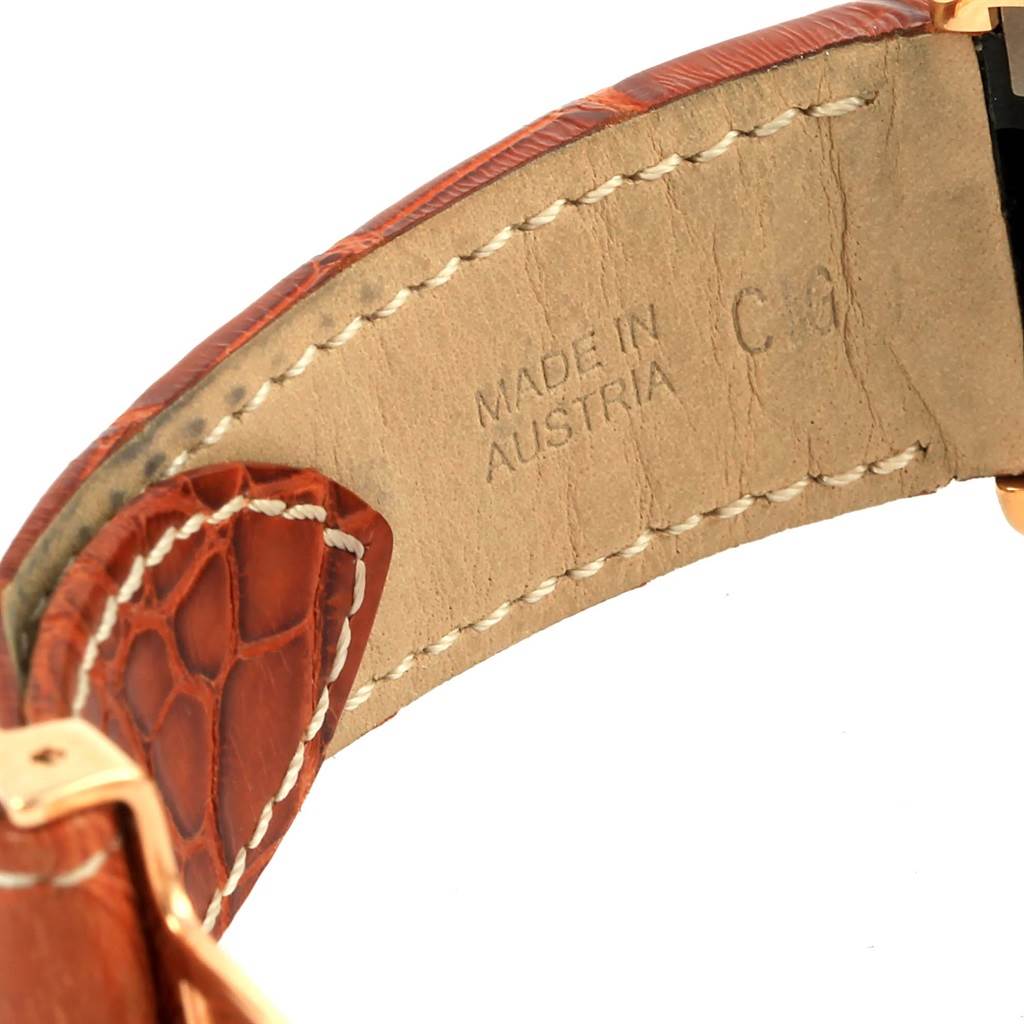 The image shows a close-up of the leather strap for the Cartier Roadster W62021Y3 Men's Yellow Gold Champagne Dial W62021Y3 Men's Yellow Gold Champagne Dial watch, highlighting the stitching and "Made in Austria" text.