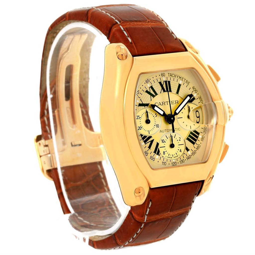 The image shows a Cartier Roadster W62021Y3 Men's Yellow Gold Champagne Dial W62021Y3 Men's Yellow Gold Champagne Dial watch angled from the front and side, highlighting the dial, case, and brown leather strap.