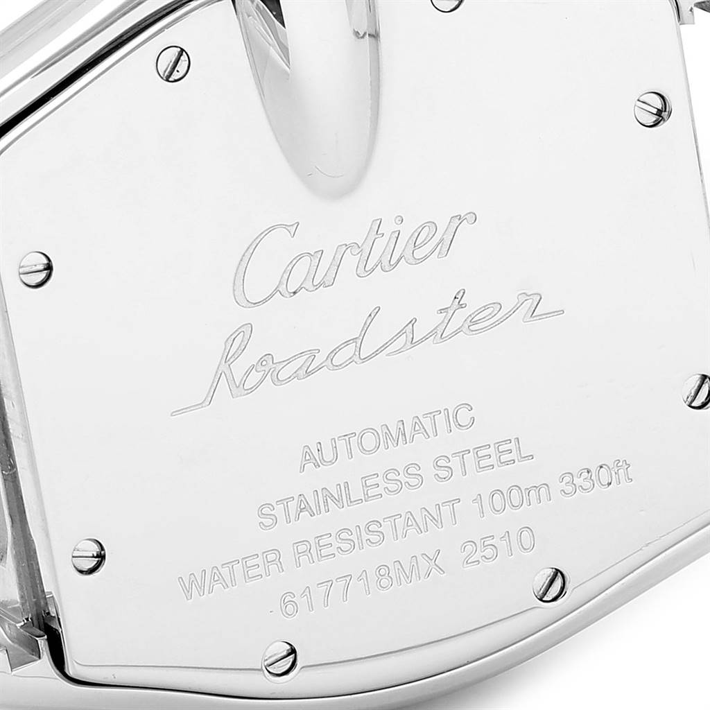 The image shows the engraved stainless steel case back of a Cartier Roadster W62041V3 Men's Stainless Steel Black Dial W62041V3 Men's Stainless Steel Black Dial watch from an angled top view.