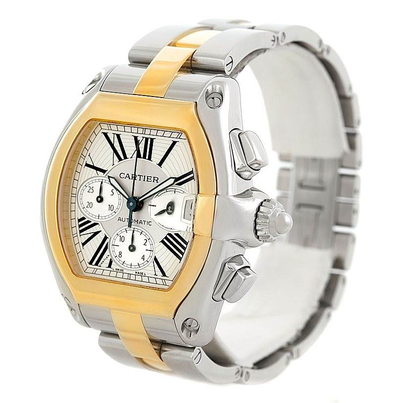 The image shows a Cartier Roadster W62027Z1 Men's Steel and Gold (two tone) Silver Dial W62027Z1 Men's Steel and Gold (two tone) Silver Dial watch with a gold and silver band, viewed from a three-quarters angle focusing on the dial and crown.