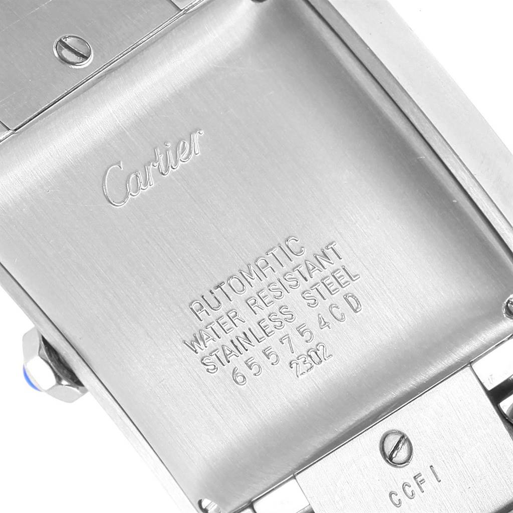 The image shows the back case of a Cartier Tank Francaise W51002Q3 Men's Stainless Steel Silver Dial W51002Q3 Men's Stainless Steel Silver Dial, displaying its engravings and metal bracelet attachment.