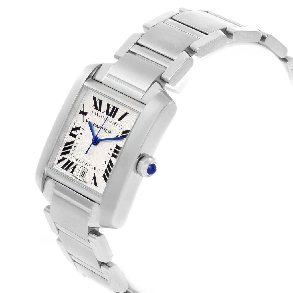 The image shows a Cartier Tank Française watch from a side angle, highlighting its rectangular dial, metal bracelet, and crown.