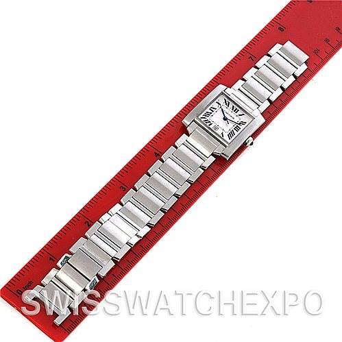 The Cartier Tank Francaise W51002Q3 Men's Stainless Steel Silver Dial W51002Q3 Men's Stainless Steel Silver Dial watch is shown flat with its face and full metal bracelet, beside a red ruler.