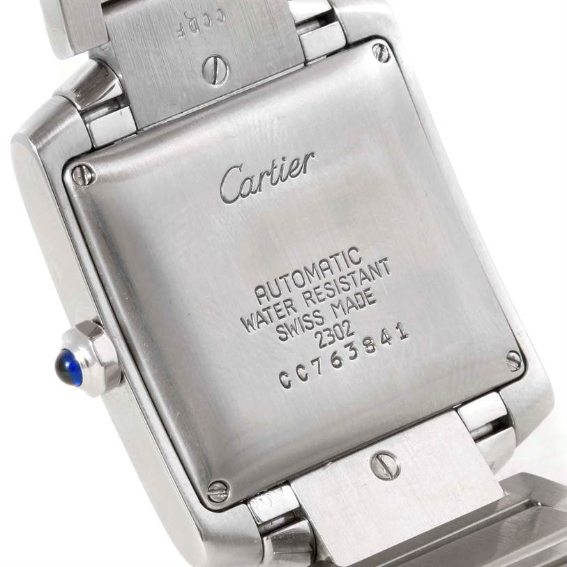 This image shows the back case and part of the bracelet of a Cartier Tank Francaise W51002Q3 Men's Stainless Steel Silver Dial W51002Q3 Men's Stainless Steel Silver Dial watch, highlighting its engravings.