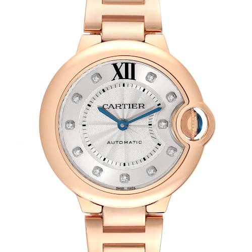 The image shows the face and part of the gold bracelet of a Cartier Ballon Bleu WE902062 Women's Rose Gold Silver Dial WE902062 Women's Rose Gold Silver Dial watch, viewed from the front.