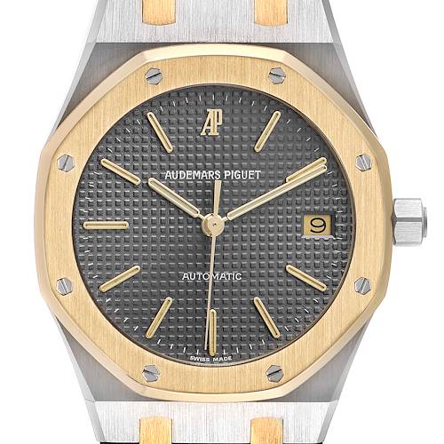 This image shows a close-up of the face of a Royal Oak watch by Audemars Piguet, highlighting its octagonal bezel and dial.