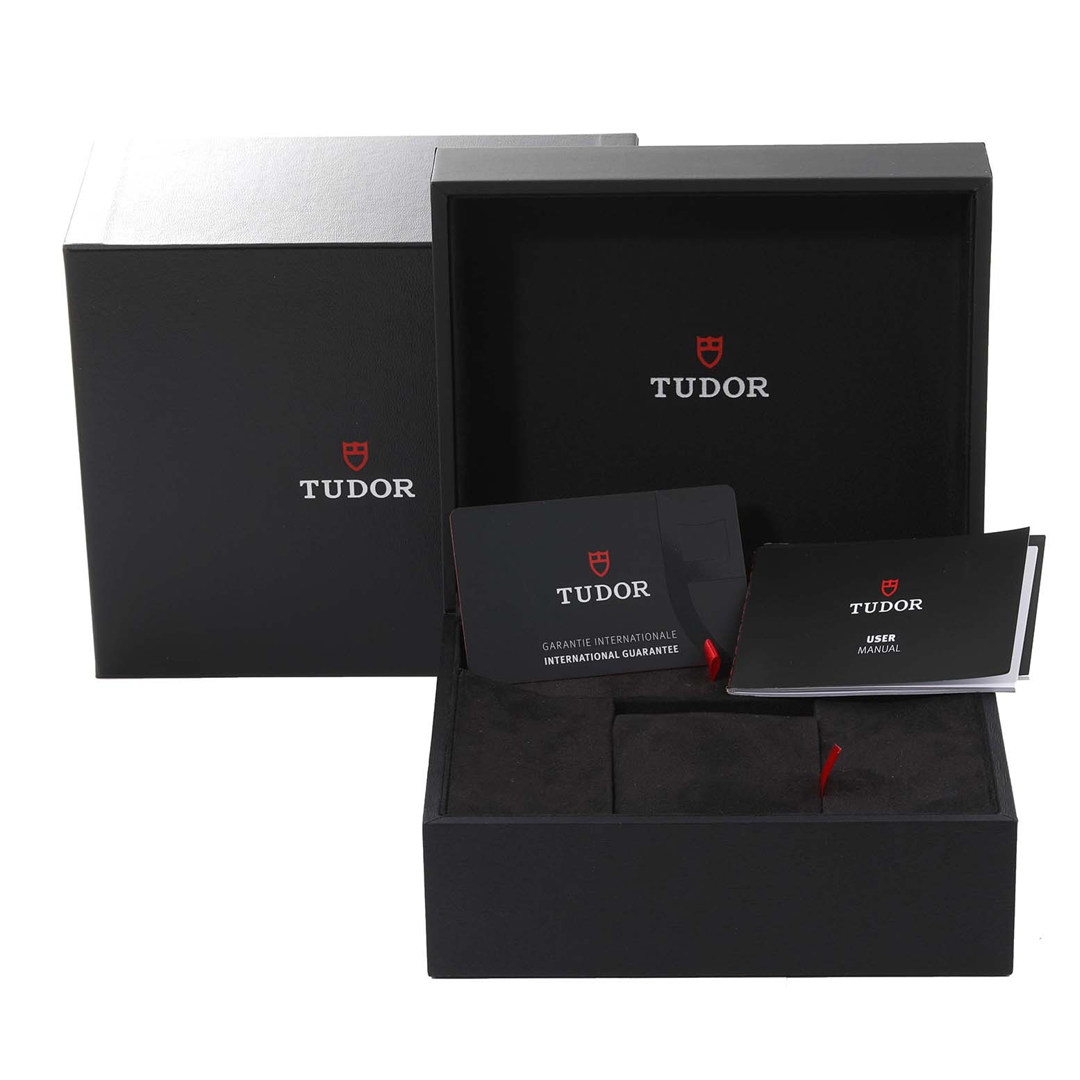 The image shows the open packaging box of a Tudor Pelagos 25407N Men's Titanium Black Dial 25407N Men's Titanium Black Dial watch, including the user manual and international guarantee card.
