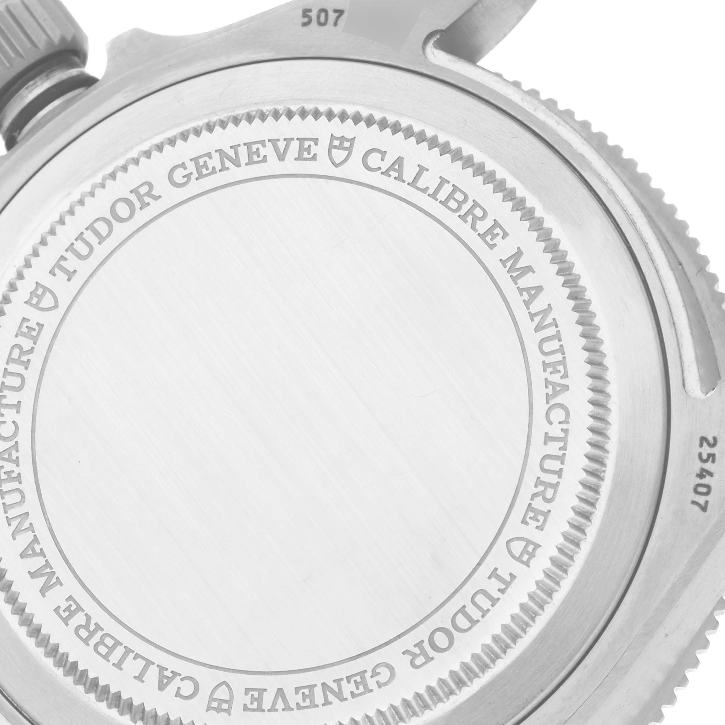 The image shows the back case of a Tudor Pelagos 25407N Men's Titanium Black Dial 25407N Men's Titanium Black Dial watch, highlighting the engraving and part of the crown.