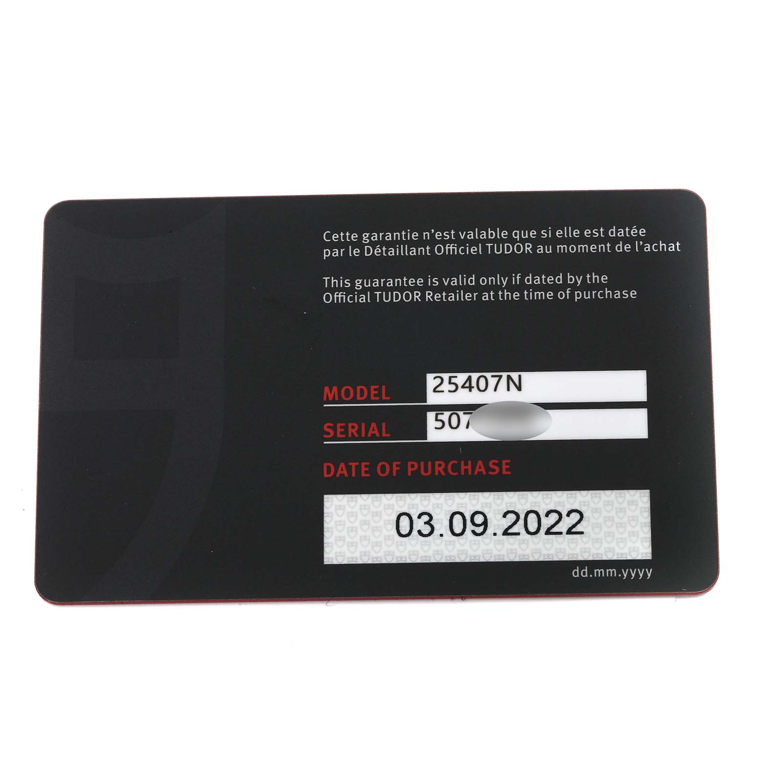 The image shows the warranty card for a Tudor Pelagos 25407N Men's Titanium Black Dial 25407N Men's Titanium Black Dial model watch from a top-down angle.