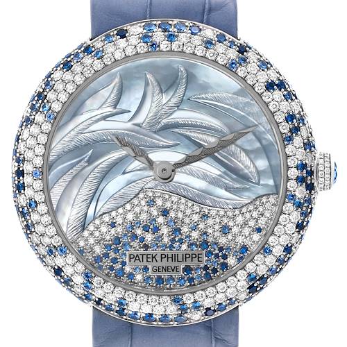 This image shows a front view of a Patek Philippe Calatrava 4899/901G Women's White Gold Mother of Pearl Dial 4899/901G Women's White Gold Mother of Pearl Dial watch with a jeweled bezel and artistic dial design.