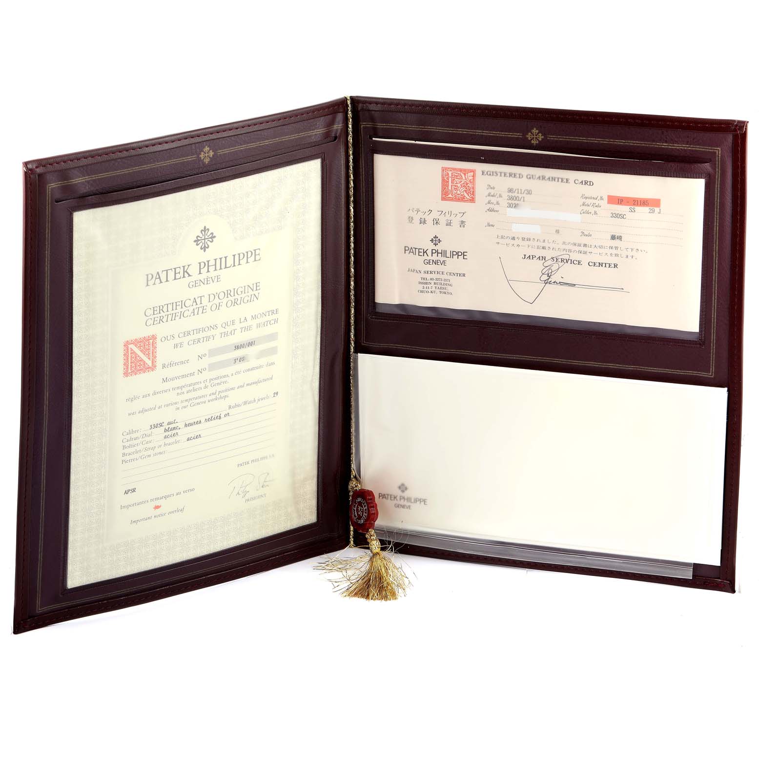 This image shows certificates and documents for a Patek Philippe Nautilus 3800/1 Men's Stainless Steel White Dial 3800/1 Men's Stainless Steel White Dial watch within an open folder.