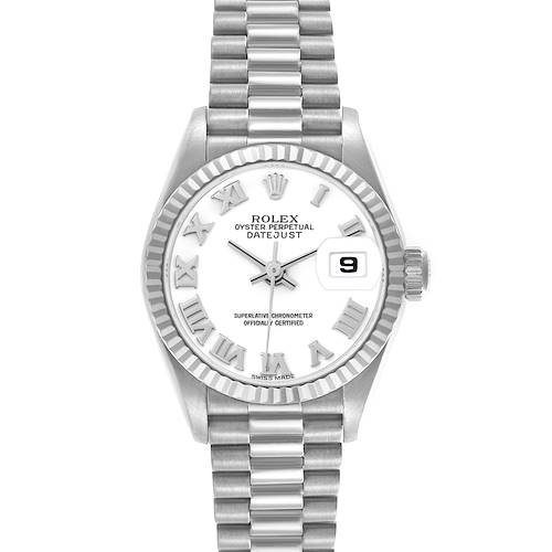 The Rolex President 69179 Women's White Gold White Dial 69179 Women's White Gold White Dial model is shown from a front angle, featuring its fluted bezel, bracelet, dial with Roman numerals, and date window.