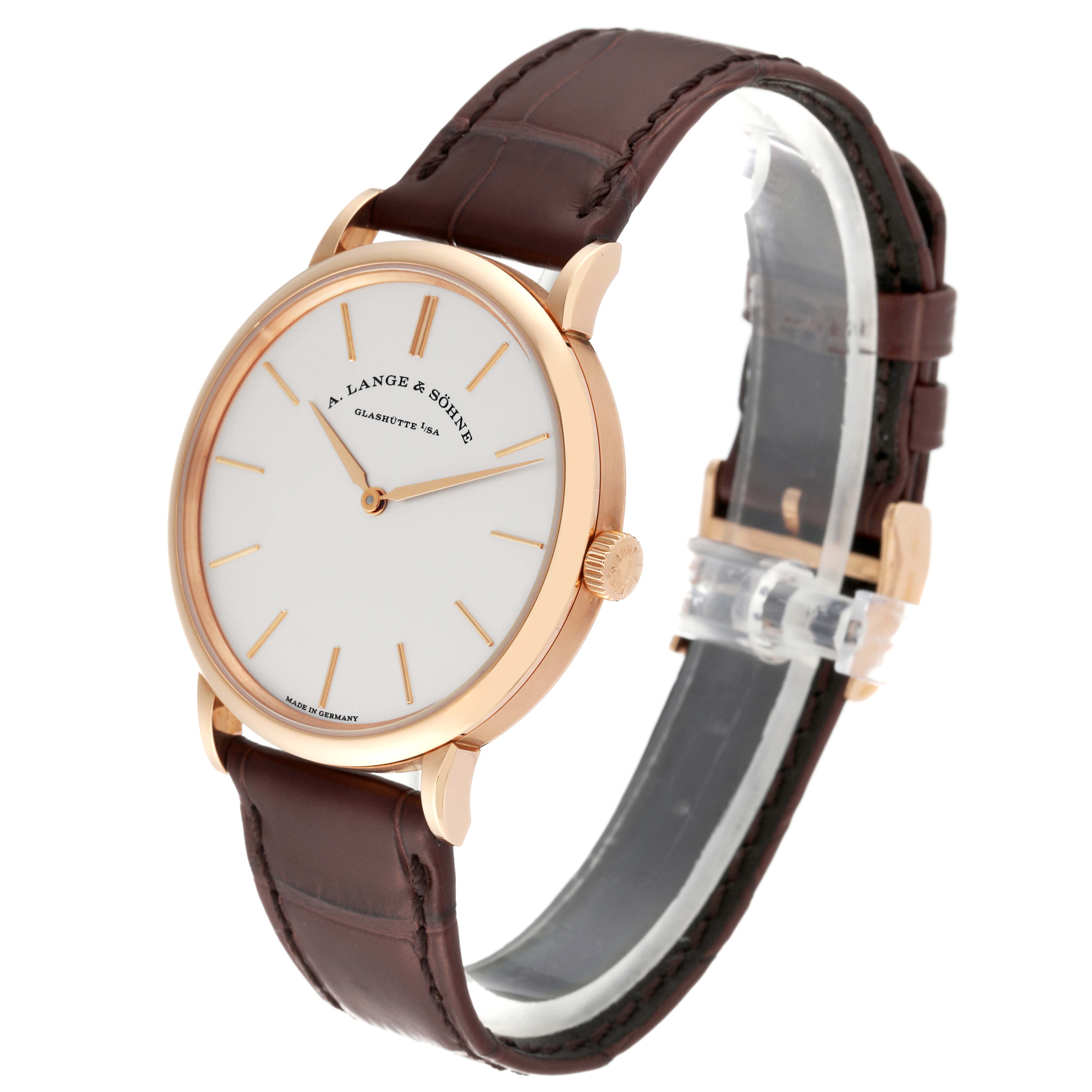 The A. Lange & Sohne Saxonia 201.033 Men's Rose Gold Silver Dial watch is shown at a three-quarter angle, featuring its white dial, gold case, crown, and brown leather strap.