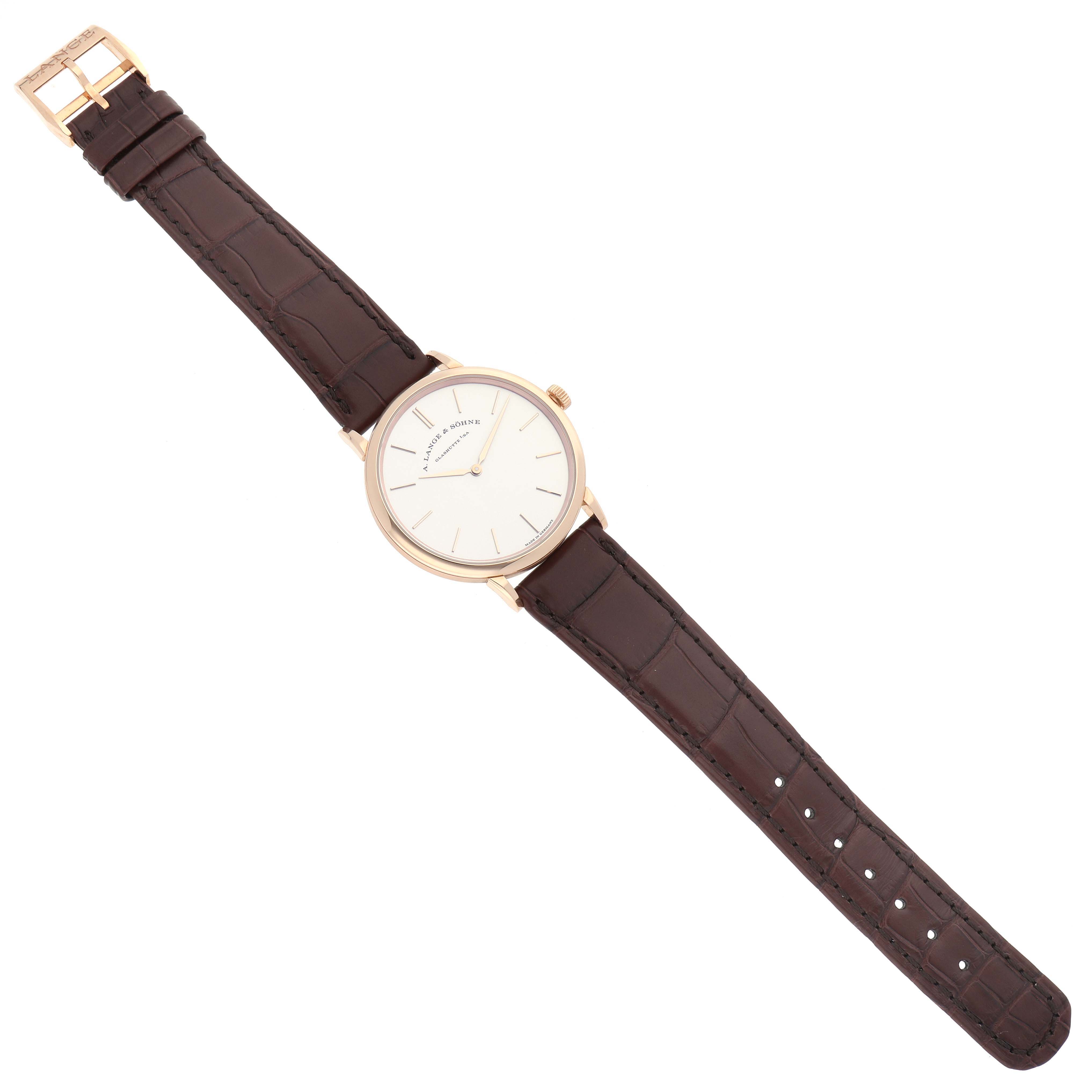 The image shows a top-down view of the Saxonia watch by A. Lange & Sohne, displaying the entire watch including its dial, case, and leather strap.