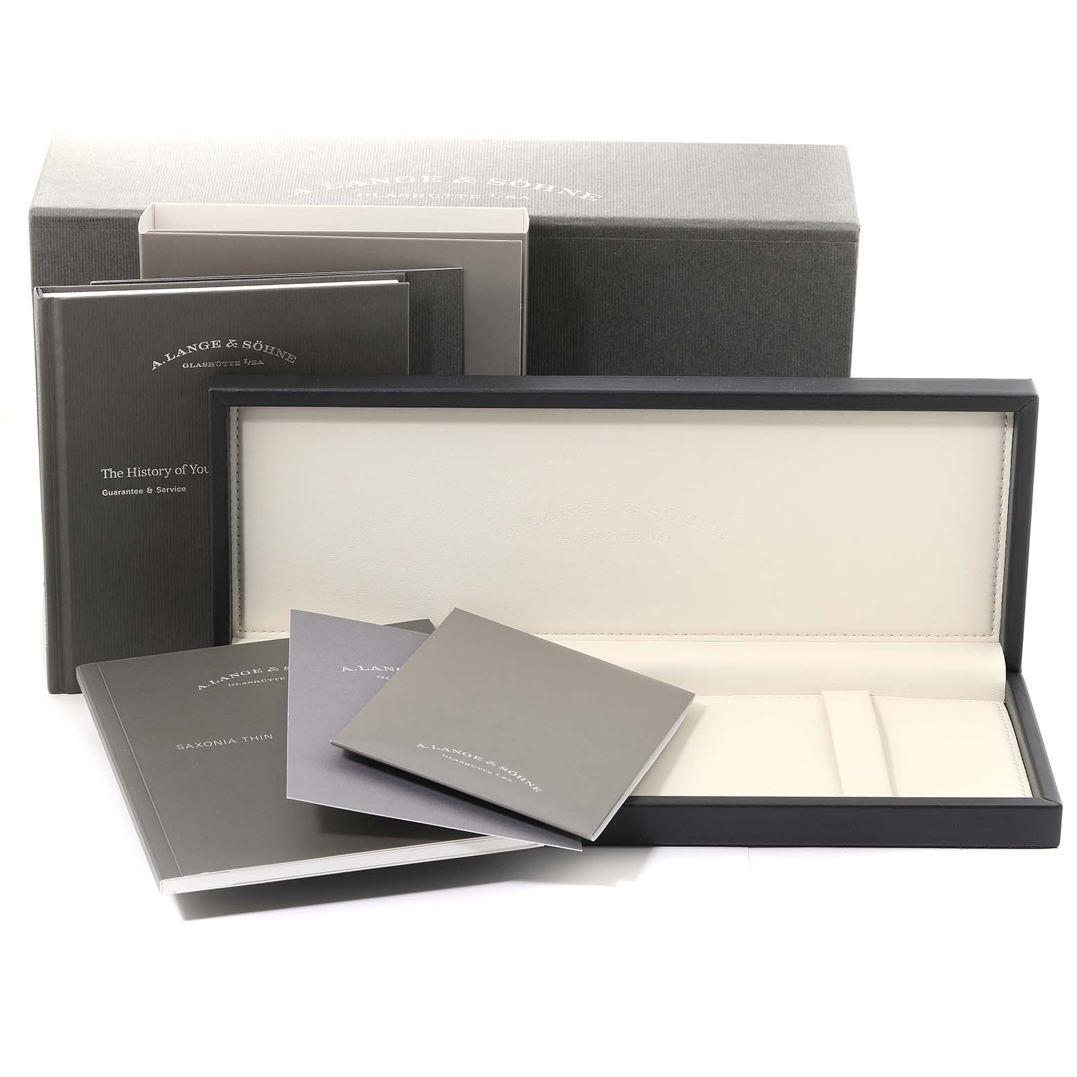 This is a packaging set for the Saxonia model by A. Lange & Söhne, showing the box, manuals, and inner display case.