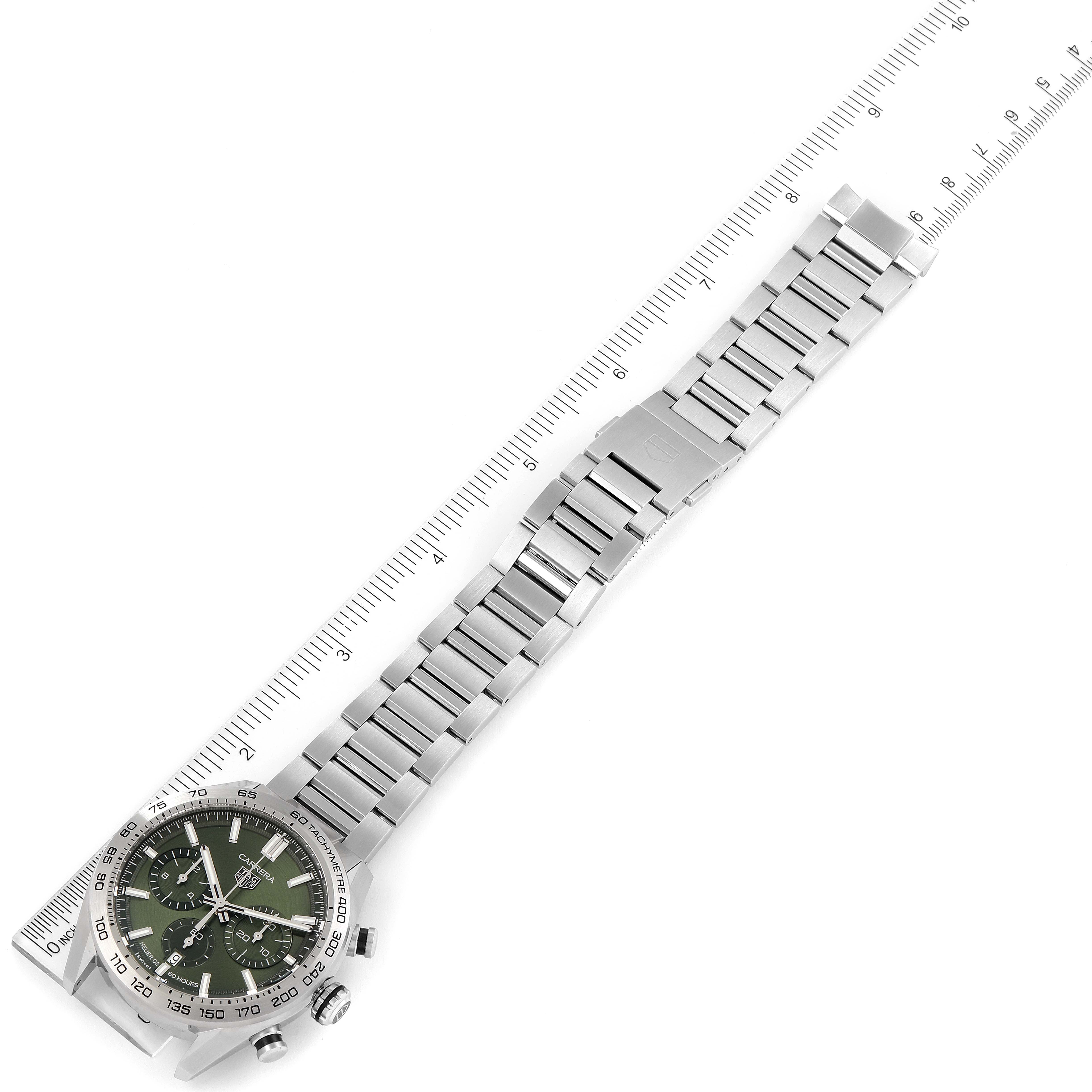 The Tag Heuer Carrera CBN2A10.BA0643 Men's Stainless Steel Green Dial CBN2A10.BA0643 Men's Stainless Steel Green Dial watch is shown at a tilted angle, displaying its metallic band, clasp, and part of the face with dials.