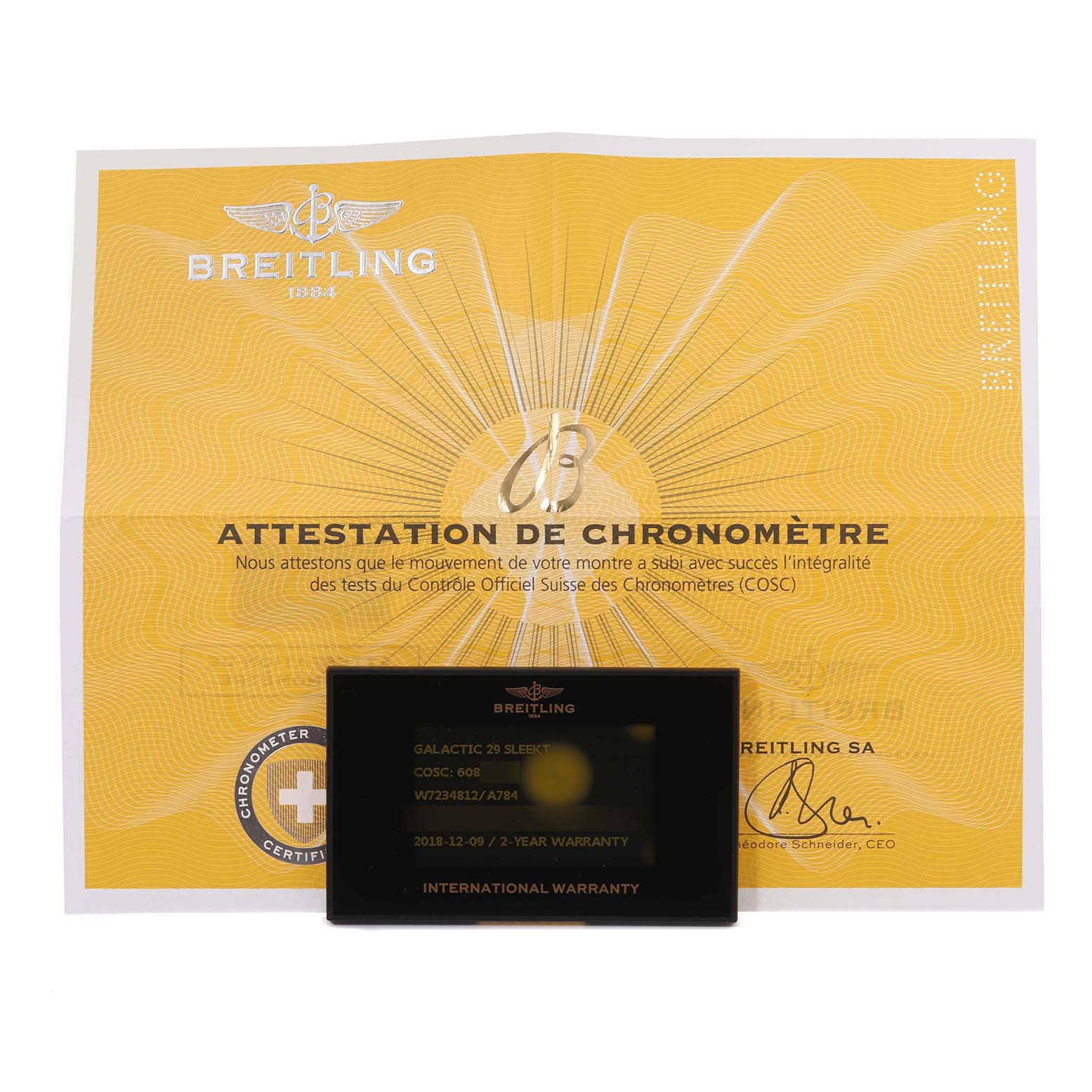 The image shows the documentation, including the warranty card and certificate, for the Breitling W7234812/A784 Women's Stainless Steel Mother of Pearl Dial W7234812/A784 Women's Stainless Steel Mother of Pearl Dial Galactic 29 Mother of Pearl Dial Steel Ladies Watch W72348.