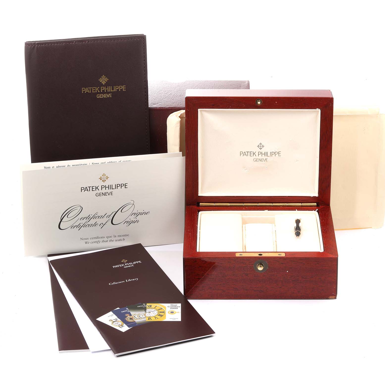 The image shows the packaging and documentation for the Patek Philippe 5146J - 01D Men's Yellow Gold Grey Dial 5146J - 01D Men's Yellow Gold Grey Dial Complicated Annual Calendar Yellow Gold Men's Watch Model 5146.